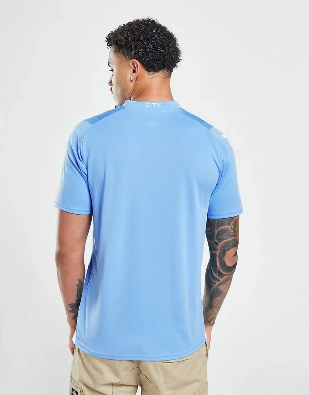 camiseta_manchester_city_primera_equipacion_23-24_espaldas